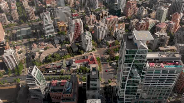 Aerial reveal of street from buildings perspective in luxury district, Santiago de Chile-4K