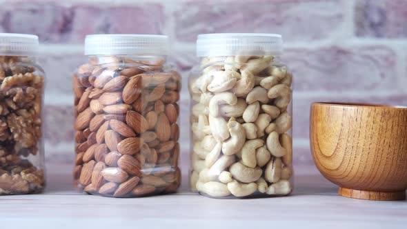 Walnut  Cashew Nut and Almond in a Container on Table