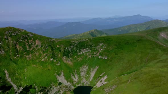 Aerial View of the highest lake of Carpathian Mountains - Brebenescul