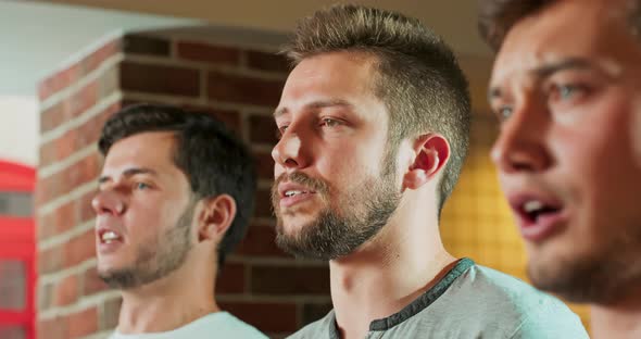 Close Up Caucasian Male Friends Standing Still in Bar When Watching Anthem at Beginning Sport