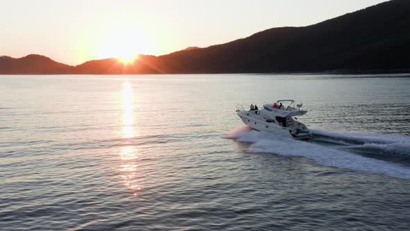 Fast moving motor yacht at the sea.