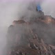Aerial Shot of Flying Over the Mountain Peaks Among the Clouds - VideoHive Item for Sale