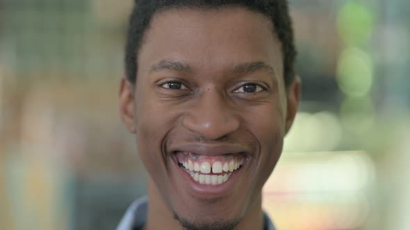 Close Up of Happy Young African Man Looking at the Camera 