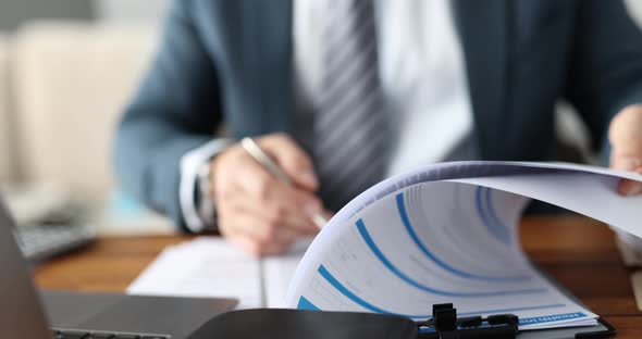 Businessman in Suit Filling Out Documents at Table in Office Closeup  Movie