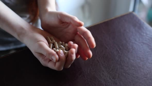 Close up shot of a  hands holding medicine pills, capsules