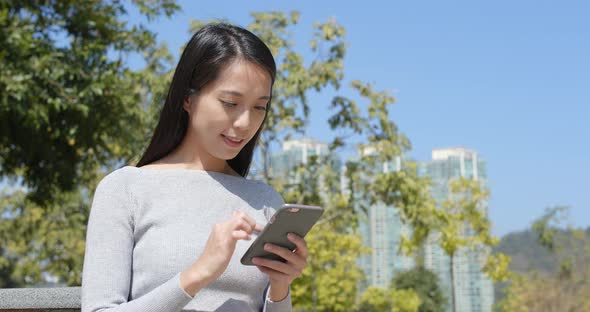 Woman Using Smart Phone at Outdoor