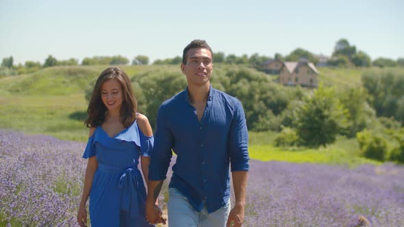 Mixed Race Couple Enjoying a Walk in Floral Glade