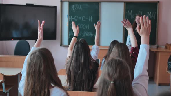 High School Students Stretch Their Hands in the Lesson