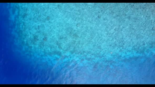 Aerial drone view tourism of idyllic bay beach lifestyle by turquoise ocean with bright sand backgro