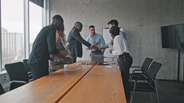 Multiracial Group of Colleagues Multiethnic Corporate Workers Shaking Hands Making Handshake