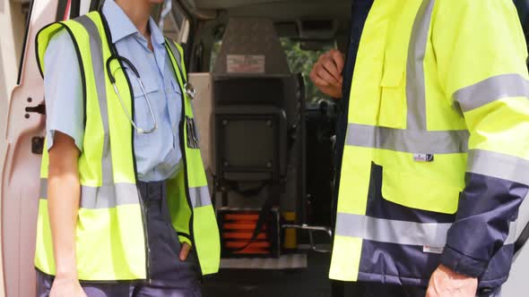 Two ambulance colleagues interacting