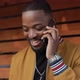 AfricanAmerican Man Chatting in Smartphone Outdoors - VideoHive Item for Sale