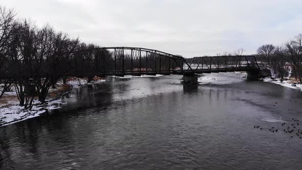 Old Bridge Over Winter Rushing River Drone