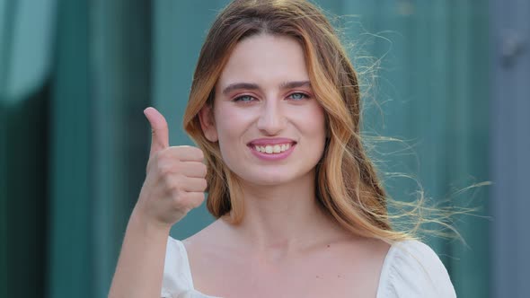 Portrait of Happy Young Confident European Caucasian Woman Stand Outdoors Look at Camera Recommend