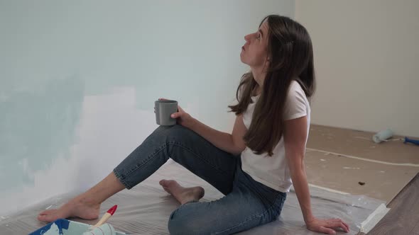 Caucasian Girl Doing Repairs Woman Resting and Drinking Tea Beautiful Girl Drinking Coffee Sitting