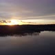 Hovering Over a Large and Big Lake at Sunset - VideoHive Item for Sale