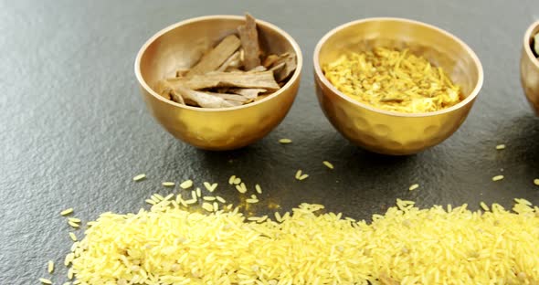Various spices in bowl with yellow rice 4k