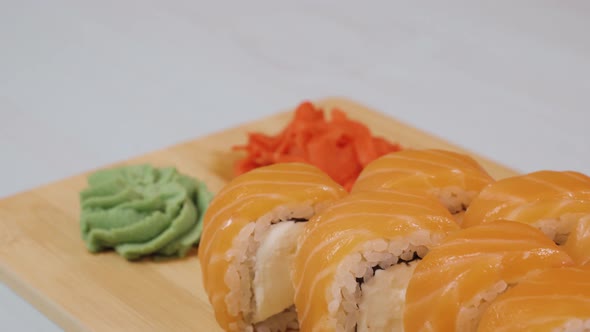 Japanese Sushi Rolls Close-up Is Moving. Variety of Types Sushi with Philadelphia. Wasabi, Ginger