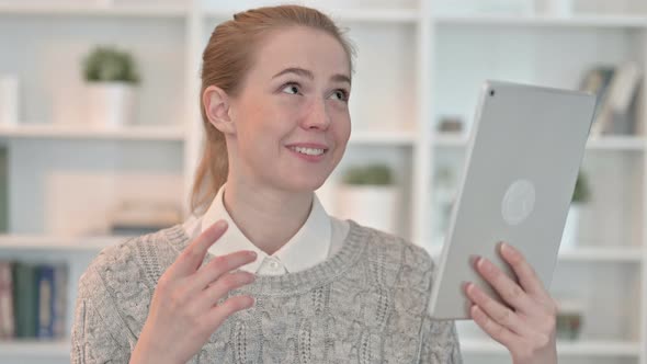 Portrait of Young Woman Doing Video Chat on Tablet