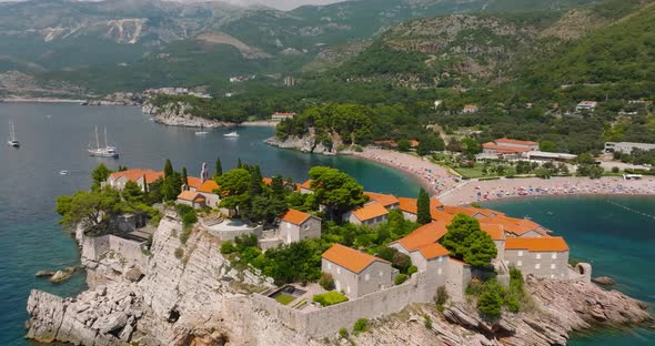 close up flying over roofs of sveti stefan island Saint Stephen