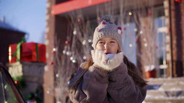 Smiling Girl Knitted Hat Fur Coat Blowing Show From Hands Christmas Decorations