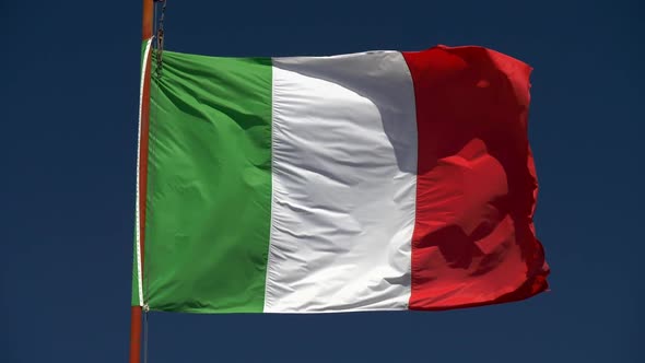 Slow Motion Shot of Waving Flag of Italy on Blue Sky Background