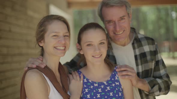 Parents with preteen daughter, portrait