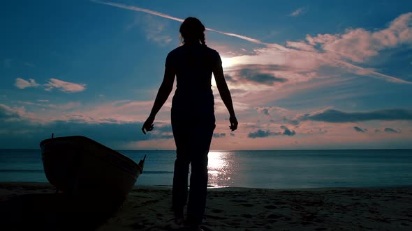 Happy and Freedom Loving Lady Is Strolling on Empty Beach of Calm Sea, Body Against Sun