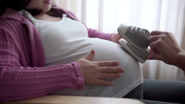 Pregnant Couple Feels Love and Relax at Home