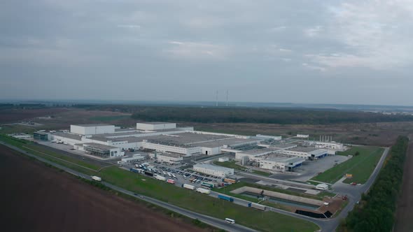 Modern industrial plant in the countryside. Industrial zone on nature landscape.