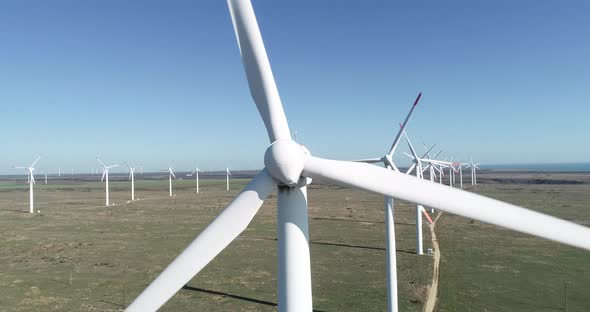 4K aerial view of windmills farm. Modern wind turbines. 