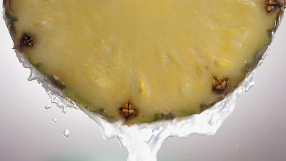 Flowing Pineapple Juice From Pineapple Slice Macro Shot in Slow Motion