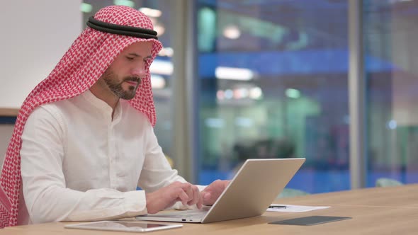 Professional Arab Businessman Working on Laptop