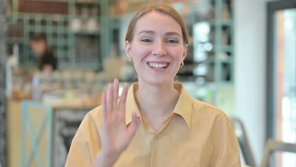 Portrait of Smiling Young Woman Doing Video Chat