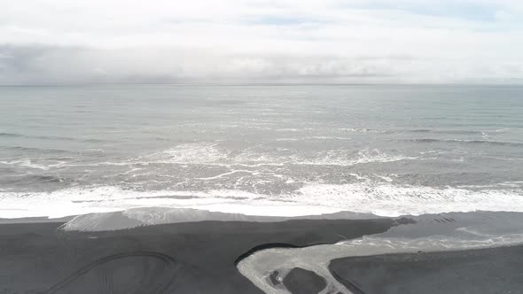 Aerial view of Black sand beach in Iceland on a sunny day