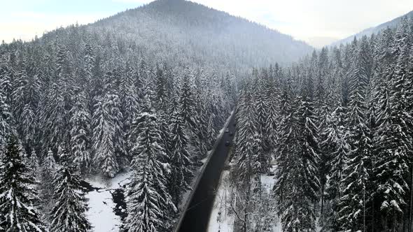 Aerial View of Snowed Winter Road in Carpathian Mountains