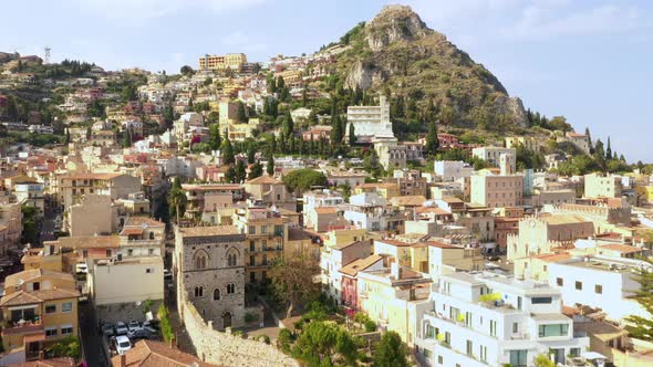 Flying towards the mountain that rises above the old Italian village with a long history. Drone flie