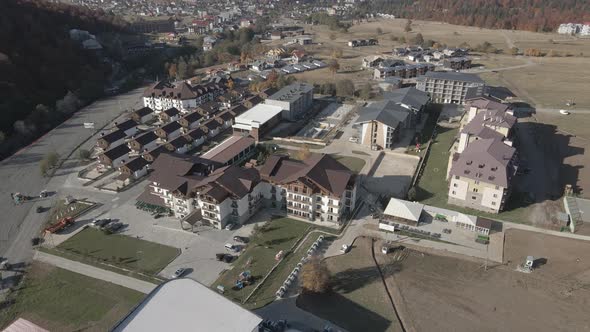 Flying over mountain resort Crystal in Bakuriani. Modern hotel in Georgian mountains