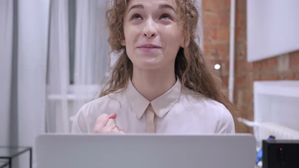 Happy Female Celebrating Success as Working on Laptop