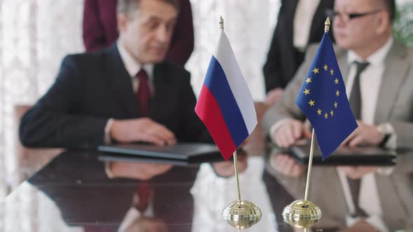 Russian And EU Diplomats Shaking Hands After Making Agreement