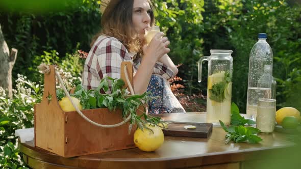 Woman Enjoying Summer Drinking Lemonade Cocktail