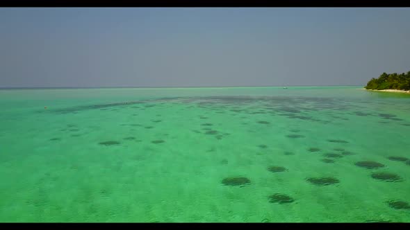 Aerial top down sky of paradise resort beach break by blue water and white sandy background of a day