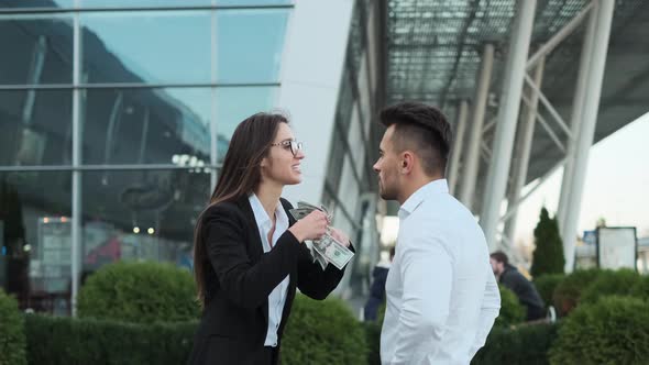 Young Business People On The Street, Discussing Business Agreement