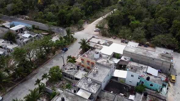 Aerial shot of houses near to the forest in Akumal, Tulum, Quintana Roo, Mexico.