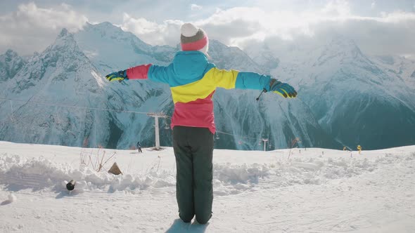 Happy Little Girl at the Winter Ski Resort. Winter Vacation Concept.