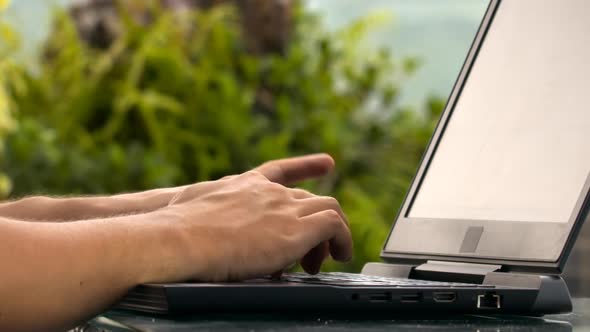 Programmer Hands Type Fast on Notebook Keyboard