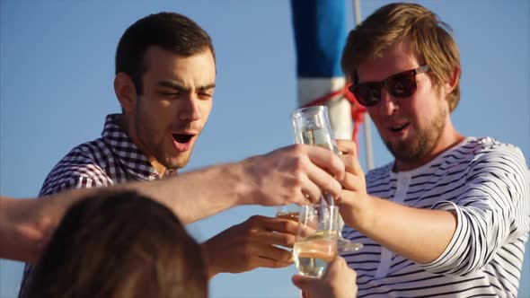 Friends Clanging Glasses During Party on the Yacht