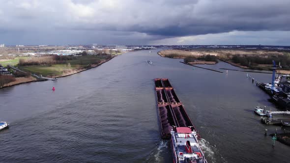 Bulk Carrier With Multiple Cargo Hold Loaded With Coal And Ore Sailing On Oude Maas River Near Putte