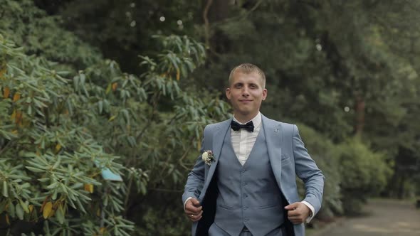 Groom, Brunette Young Man in the Park. Wedding Day. Businessman