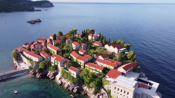 Flying Over Scenic Island on the Rock in the Sea